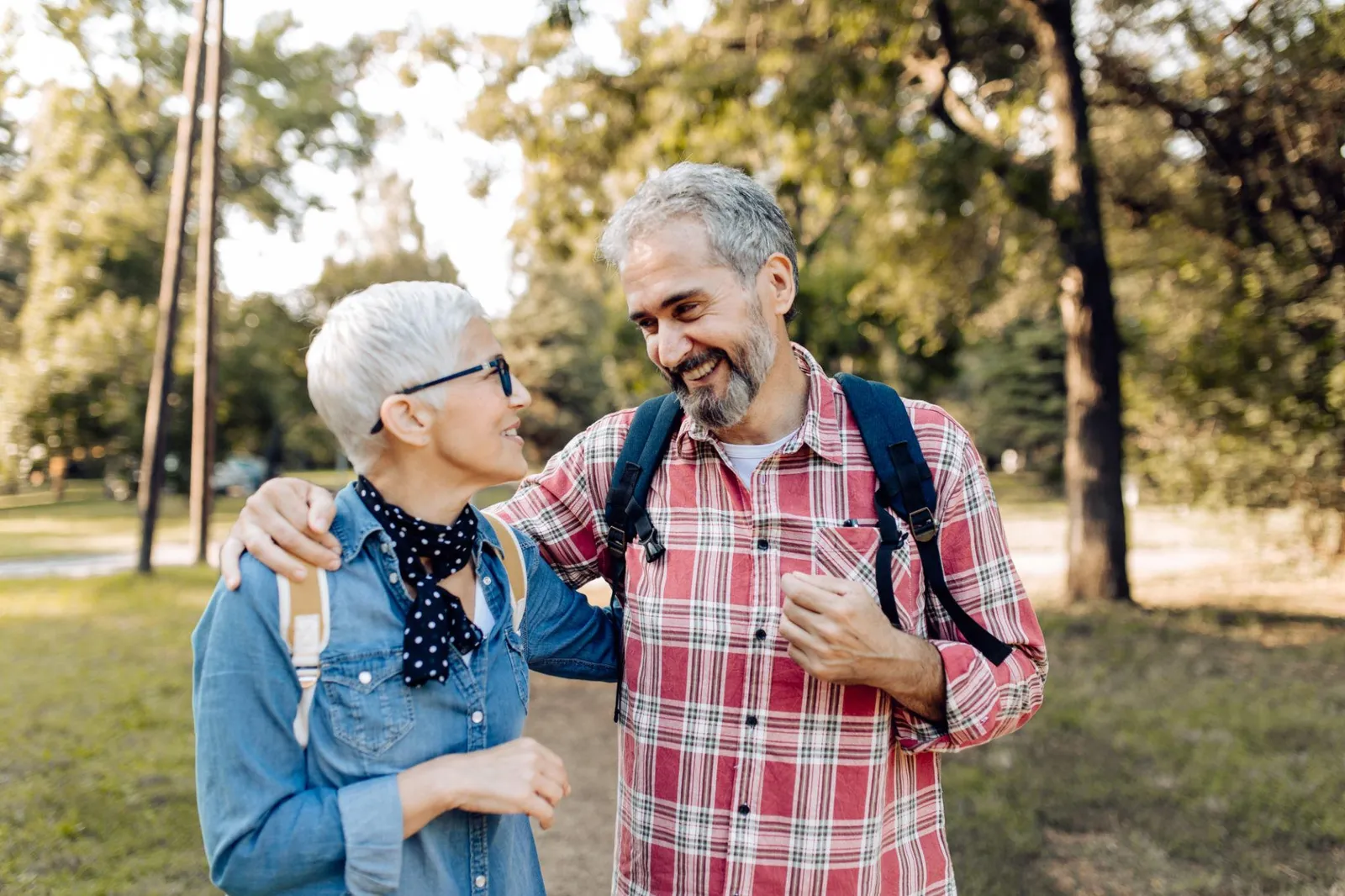 Active retired couple hiking together outdoors