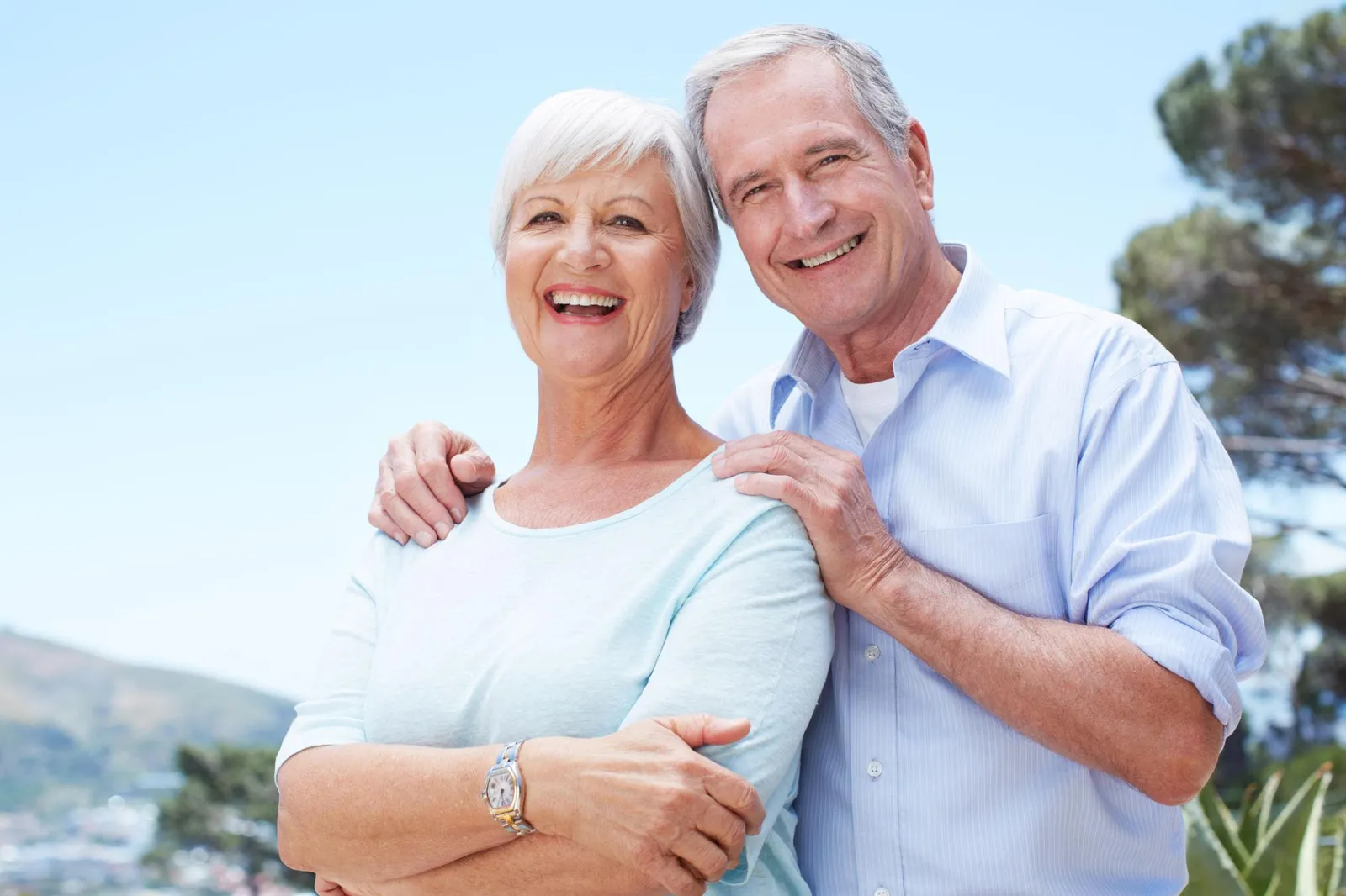 Smiling senior couple who own their health coverage
