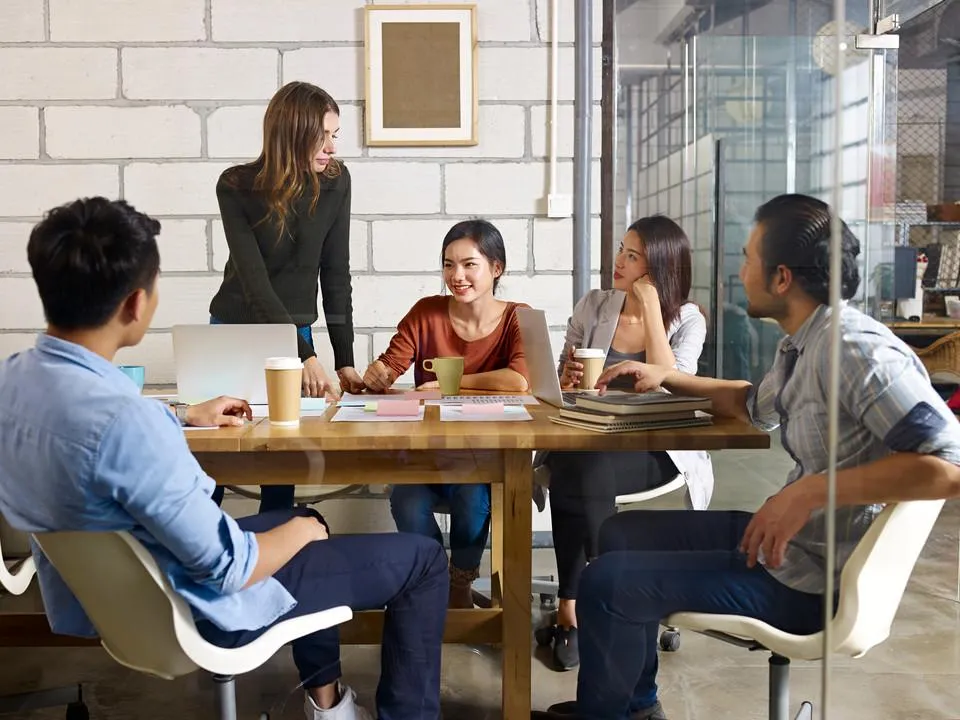 Startup team brainstorming around a table