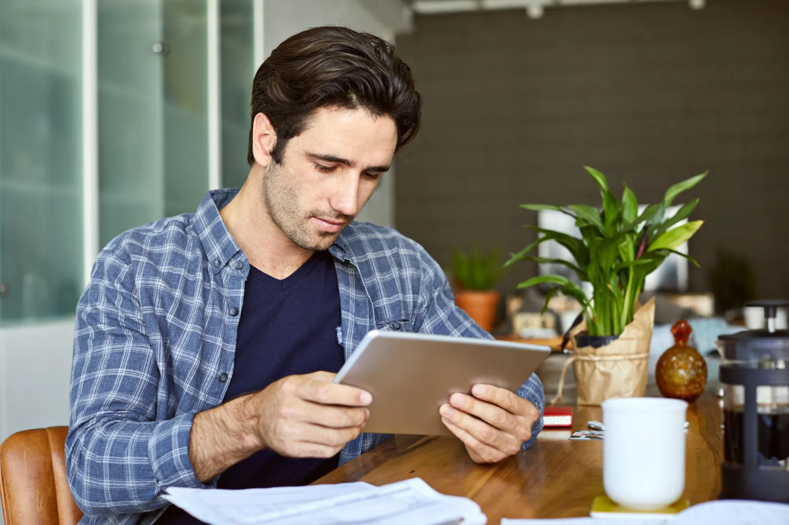 Seasonal worker checking the schedule on a tablet