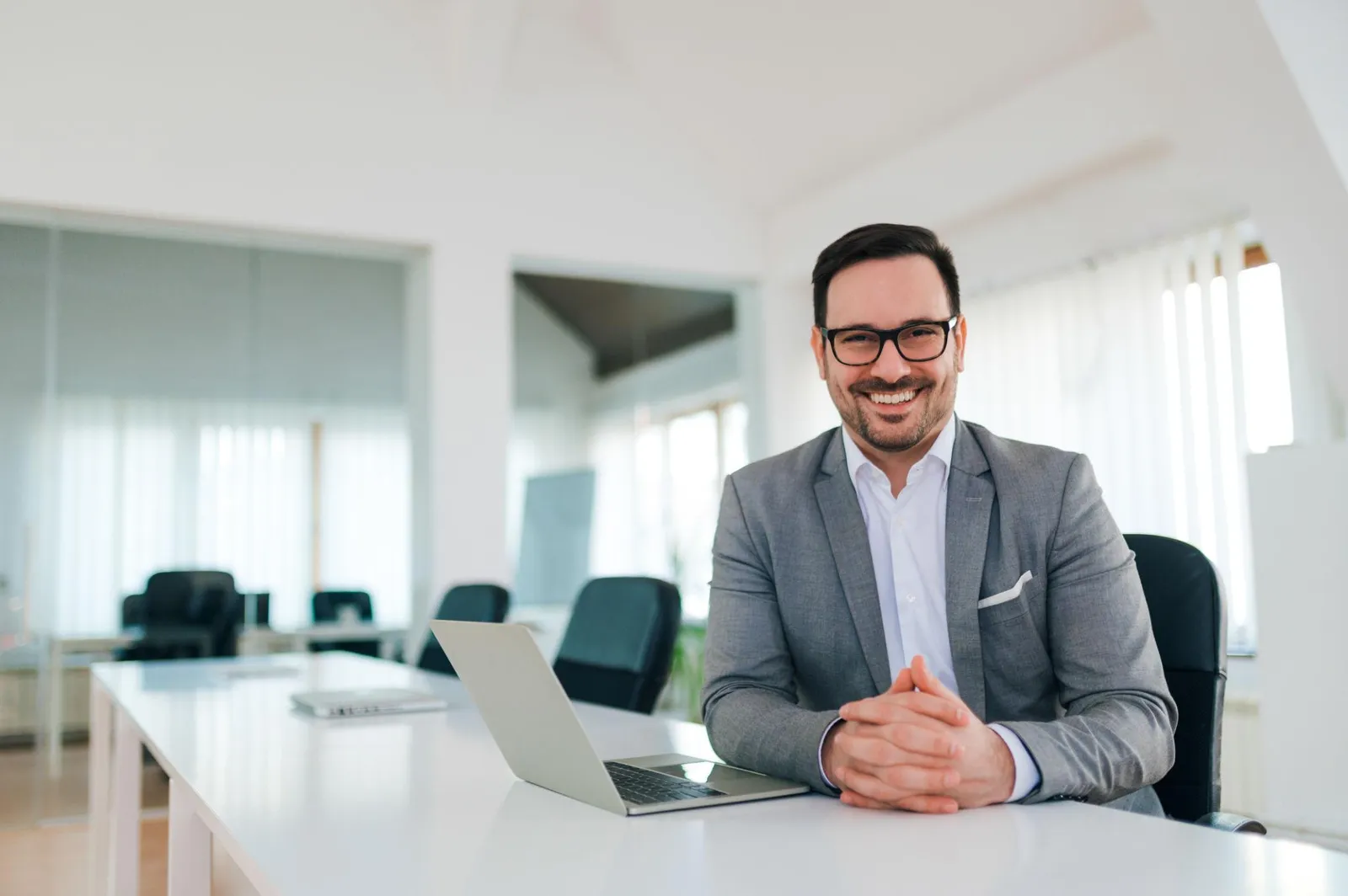 Confident freelancer reviewing his health coverage at his desk