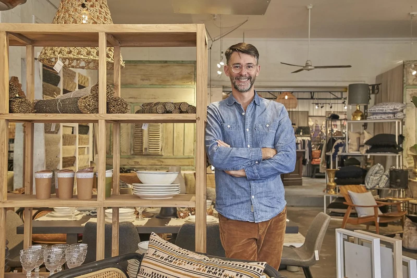 Small business owner standing in his retail store