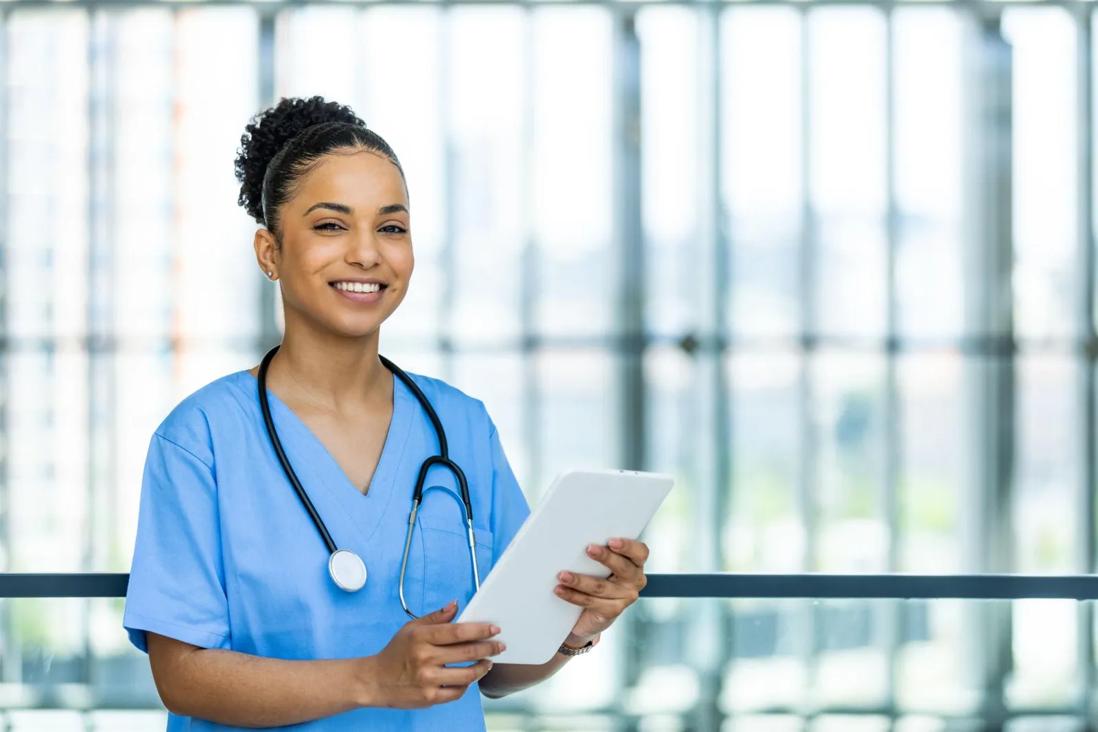 Travel nurse reviewing private PPO plan options on a tablet